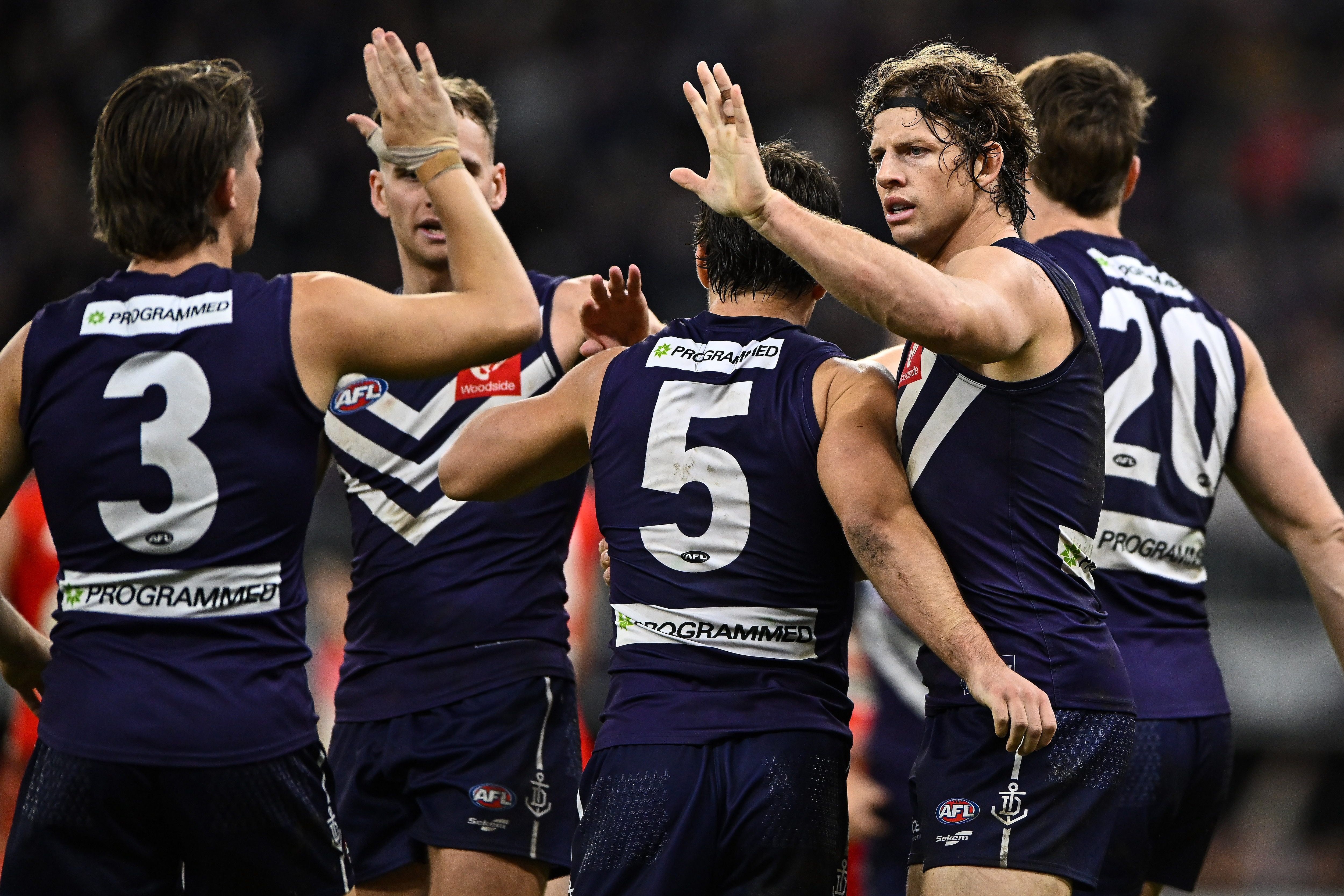 Players rally around the skipper